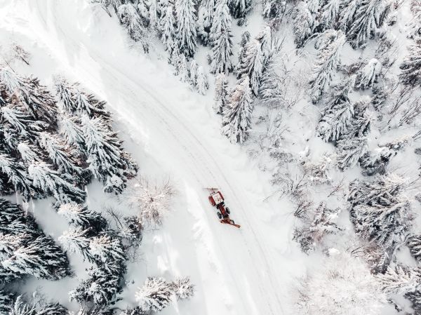 Aerial Drone Shot of a Snowy Road Free Photo