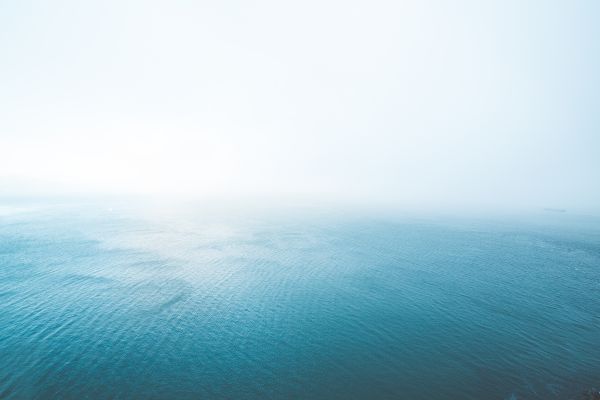 Blue Endless Ocean in Fog Free Photo