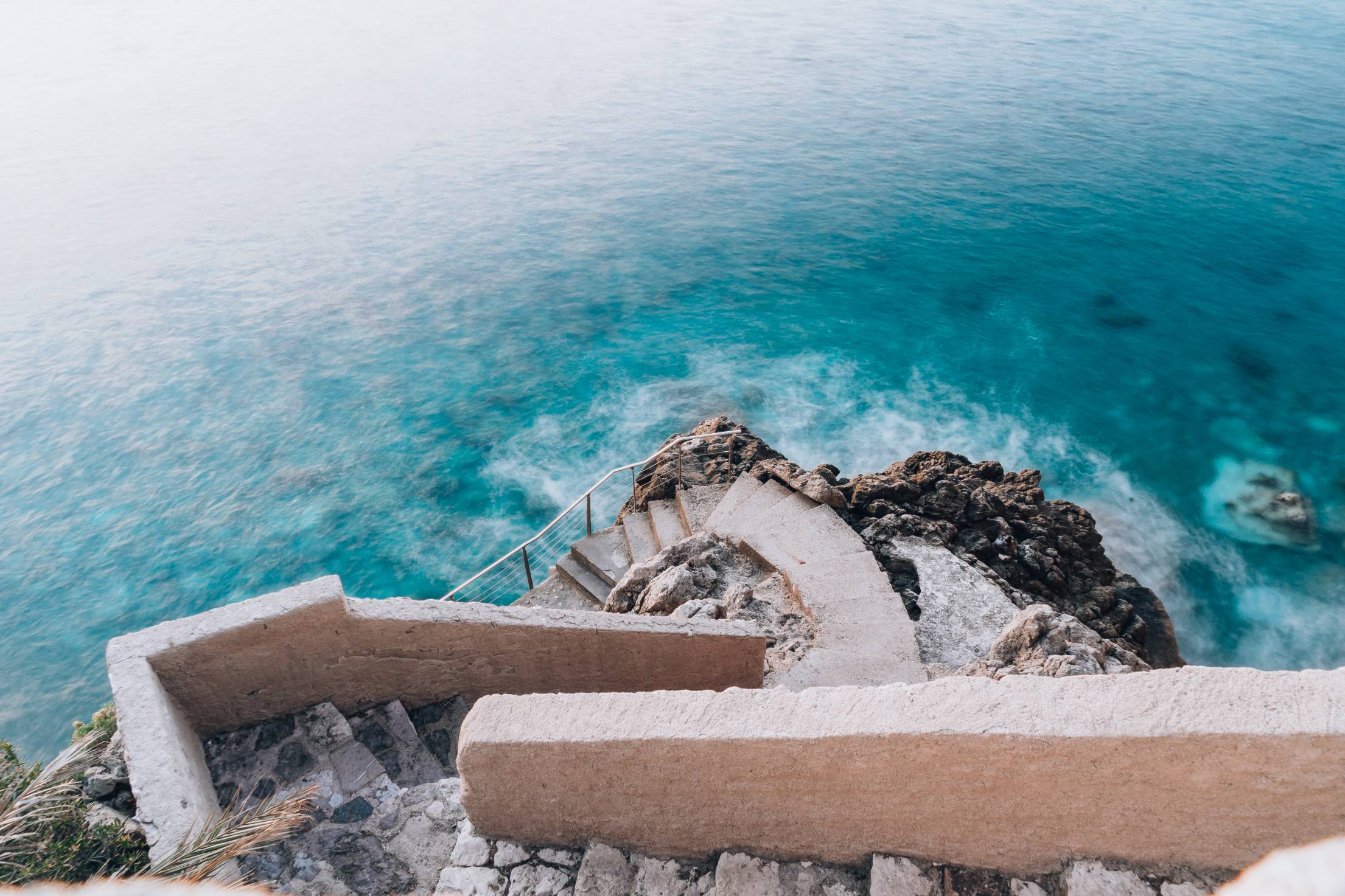 Blue Mediterranean Sea Coast with Stairs Free Photo