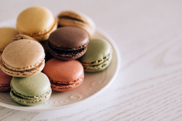 Colorful Macarons on a Vintage Plate Free Photo