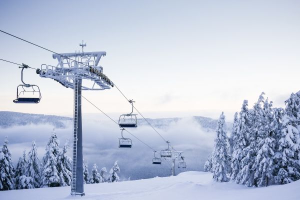 Empty Chair Ski Lift on Bright Winter Day Free Stock Photo