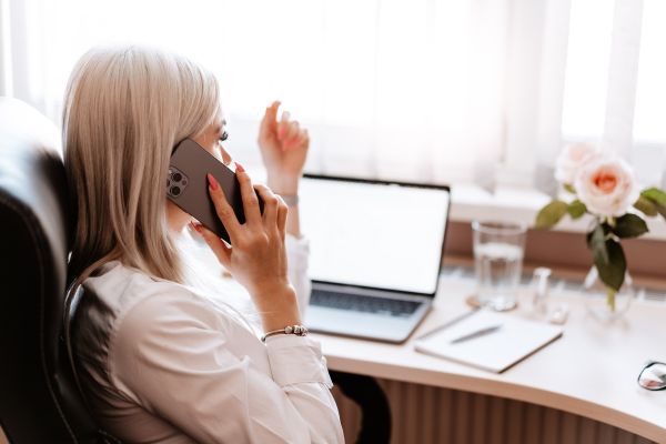 Freelance Woman Entrepreneur Calling in Home Office Free Stock Photo