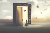 poetic encounter between a woman and butterflies coming out of a book