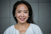 Attractive senior Chinese woman smiling