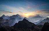 Aerial view of misty mountains at sunrise