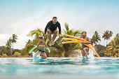 Tourists bathing in resort swimming pool