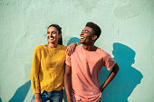 Portrait of two smiling couple looking away.