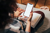 Anonymous Woman Using her Mobile Phone at Home (Blank Screen, Copy Space)