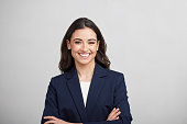 One businesswoman studio portrait looking at the camera.