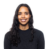 Studio portrait of a smiling young latin woman