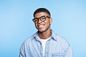 Friendly young man wearing denim shirt