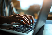 Close up of a hands on a laptop keyboard