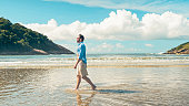 Man walking and contemplating the sea