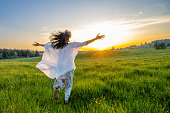 Woman walking in meadow