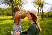 Mother and son enjoying a carefree spring day in the country side