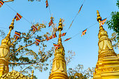 Buddhist flags hang in a Khmer temple