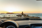 Enjoying sunset by the sea