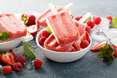 Strawberry and raspberry popsicles