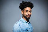 Portrait Of Happy Man Against Gray Background