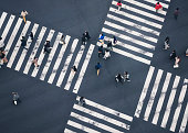 People walking on Crossing city street crosswalk top view