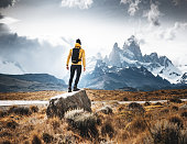 man resting on the rock in el chalten