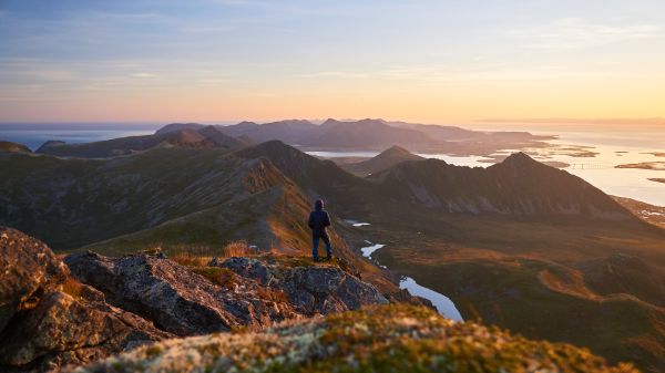 Man on Hiking Adventure During Beautiful Sunrise Free Photo