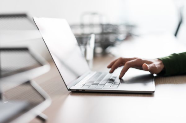 Man Using His Laptop in the Office Free Photo