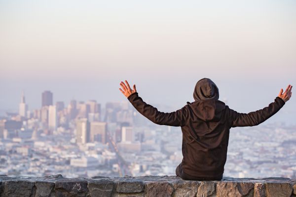 Man with Open Arms Saluting the San Francisco City Free Photo