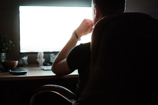 Night Owl Man Working on Computer at Night Free Photo