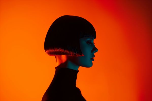 Professional Studio Portrait of a Girl With Orange Background Free Image