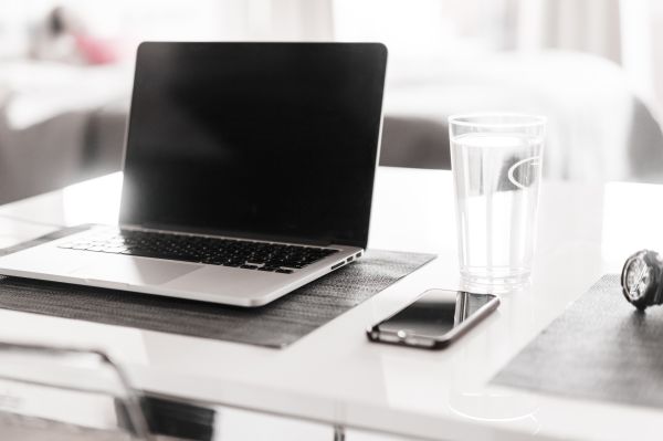 Sleek Home Office Working with Laptop and Smartphone Free Photo