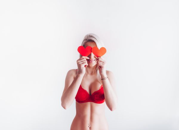 Smiling Woman with Lovely Valentine’s Day Hearts Free Photo