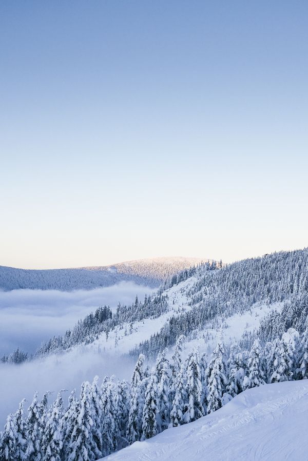 Snowy Hills with Cloudless Sky Free Photo