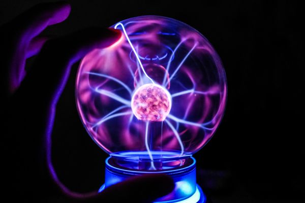 Touching The Plasma Ball Lamp Free Photo