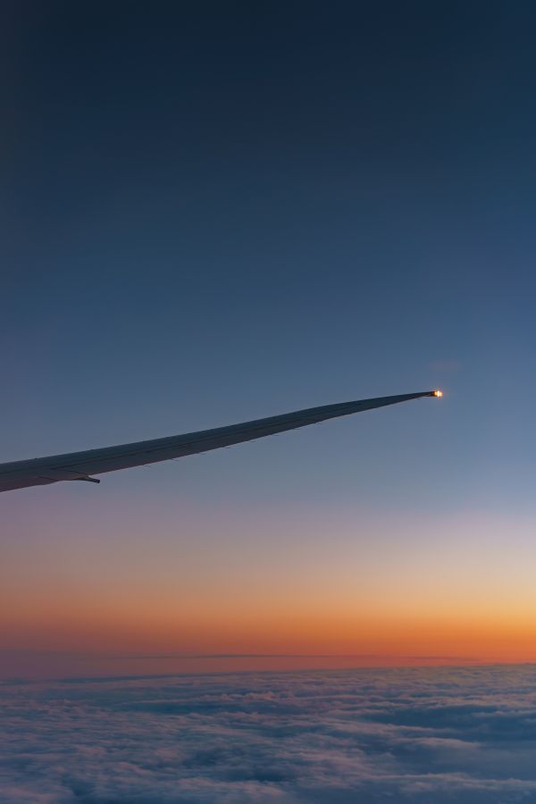 View from Airplane Window on the Wing After Sunset Free Photo