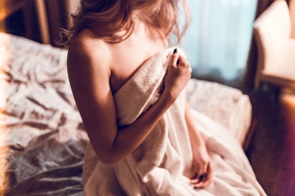 Vintage Grainy Film Photo of Young Woman in a Hotel Room Free Photo