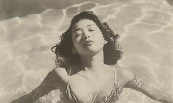 Vintage Retro Sepia Tone Archive Photo of a Young Japanese Woman in a Pool Free Image