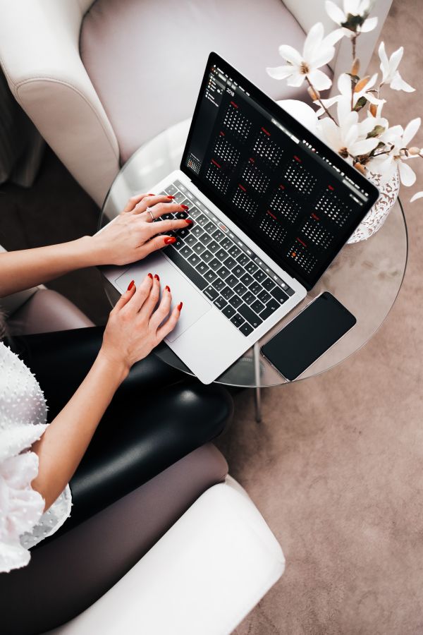 Woman Entrepreneur Working on her Laptop Free Photo