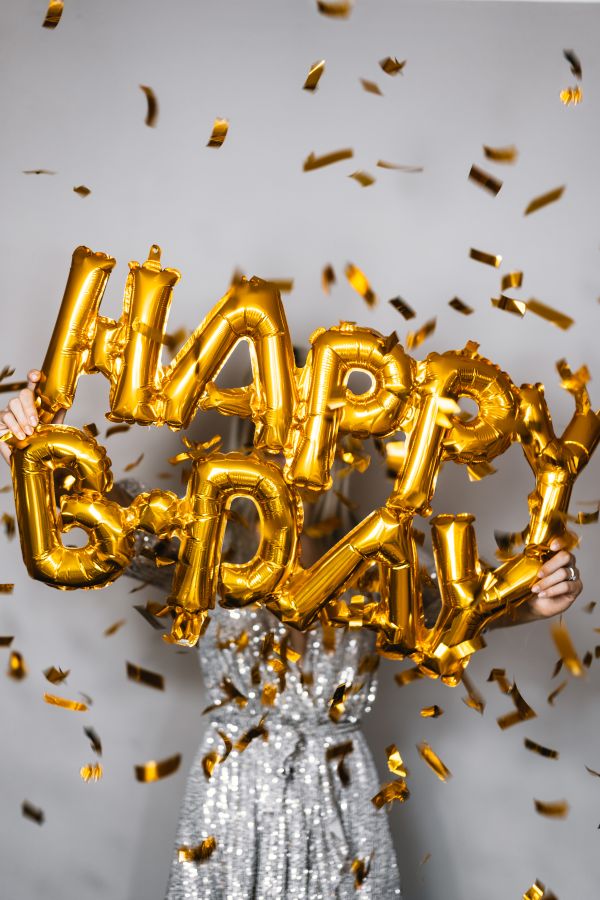 Woman Holding Happy Birthday Balloons Free Photo