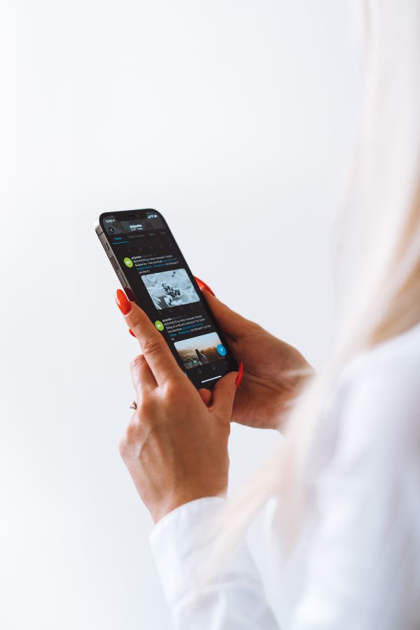 Woman Reading on a New Smartphone Free Stock Photo