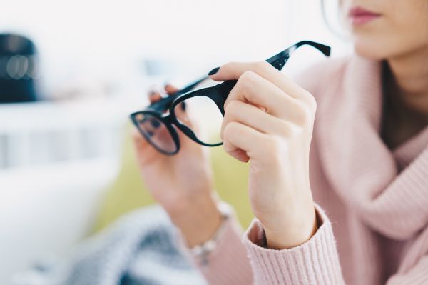 Woman Trying Eyeglasses in Optical Store Free Photo