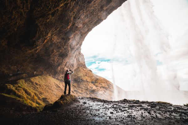 Woman Under Seljalandsfoss Waterfall, Iceland Free Photo