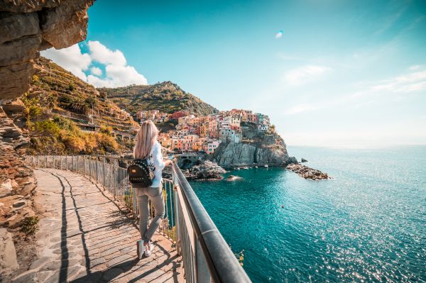 Young Traveler Admires Beautiful Manarola Town, Italy Free Photo