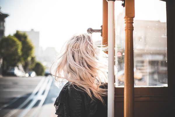 Young Woman Enjoying Ride on an Iconic Cable Car in San Francisco #2 Free Photo