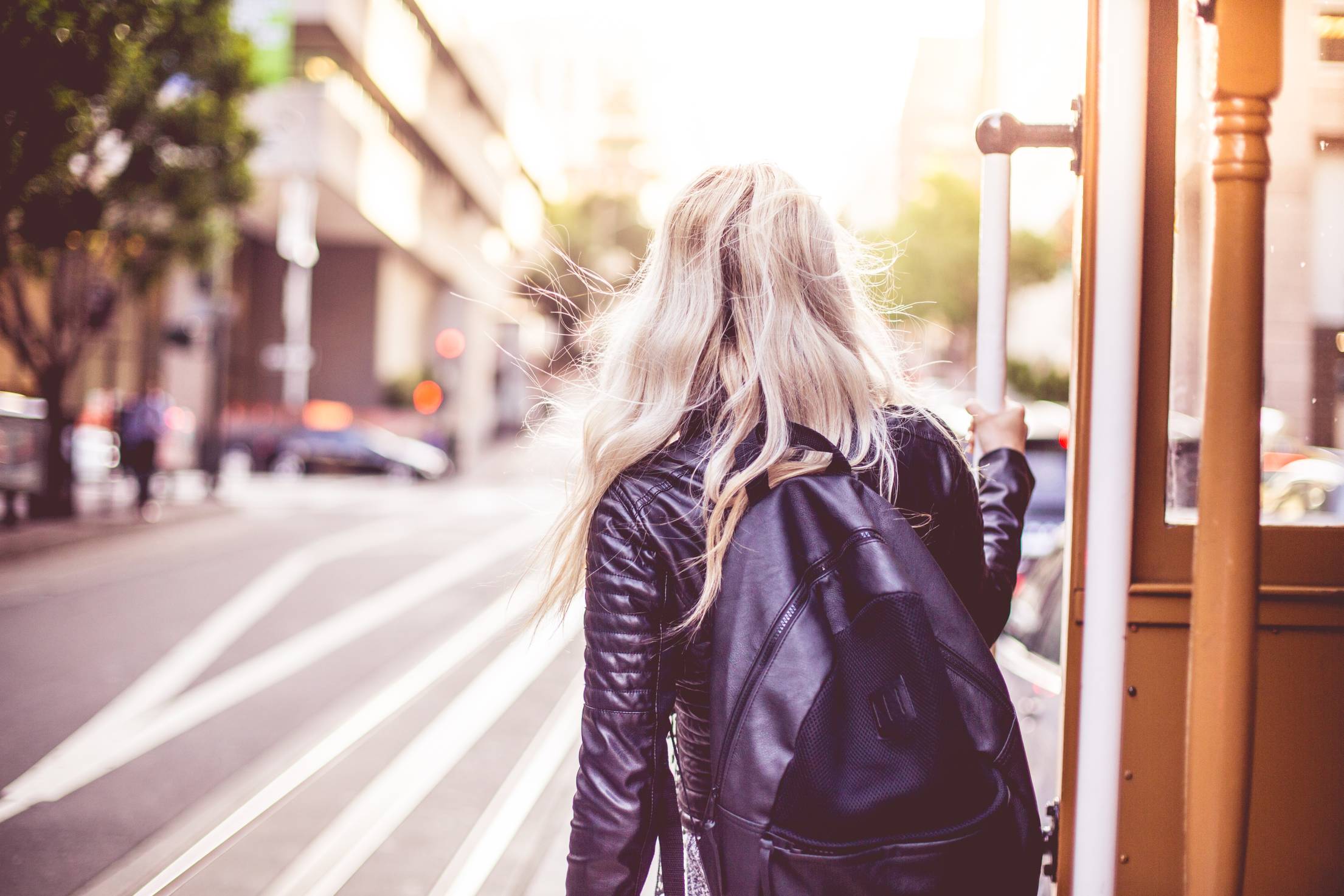 Young Woman Enjoying Ride on The Iconic Cable Car in San Francisco Free Photo