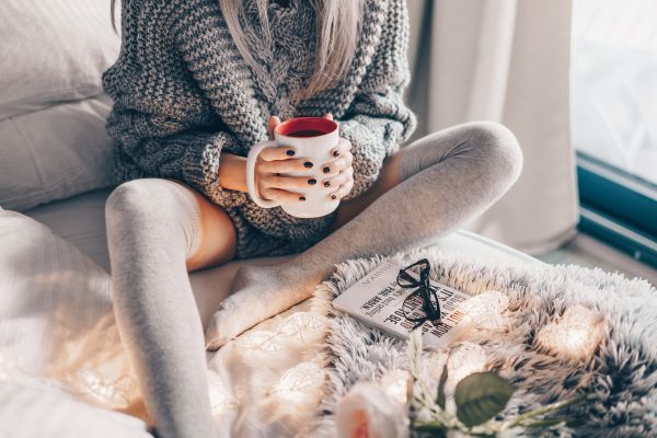 Young Woman in Bed with Hot Tea Free Photo