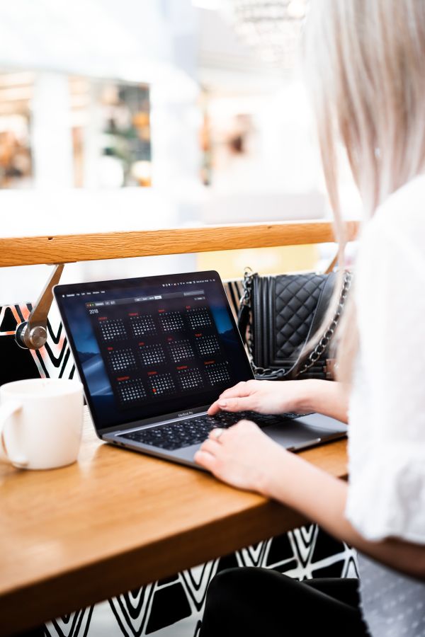 Young Woman Remote Working in a Café Free Photo