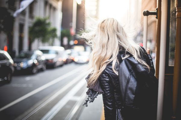 Young Woman Riding The Famous Cable Car in San Francisco Free Photo