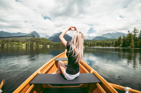 Young Woman Showing Heart Symbol with Hands Free Photo