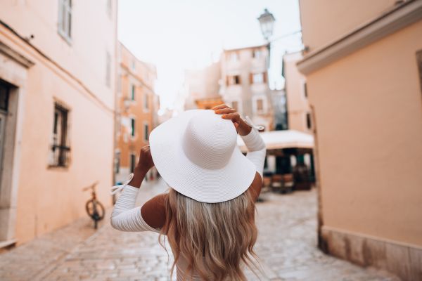 Young Woman Solo Traveler Exploring Streets of an Old Croatian Town Free Photo